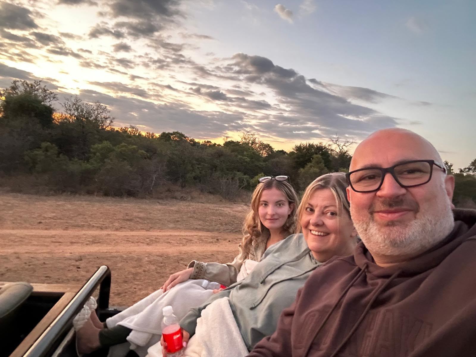 Alison, Tony and Ella on a sunset safari drive